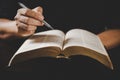 Young woman person hand holding holy bible with study at home. Adult female christian reading book in church. Girl learning