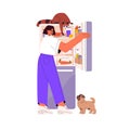 Young woman with pets looking inside open full fridge. Cute raccoon reaching for food in refrigerator. Hungry dog