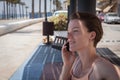 Young woman phone on beach bench Royalty Free Stock Photo