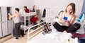 Young woman with phone on bed in hostel Royalty Free Stock Photo