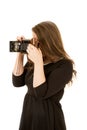 Young woman photographer taking picture with antique camera Royalty Free Stock Photo