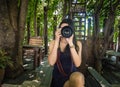 Young woman photographer taking picture in the cafe Royalty Free Stock Photo