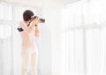 Young woman photographer working in studio Royalty Free Stock Photo