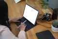 Young woman photographer working with tablet computer on wooden table. Royalty Free Stock Photo