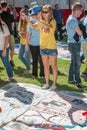 Young Woman Photographs AIDS Quilt Section