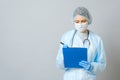 Young woman physician with stethoscope prescribing treatment to patient Royalty Free Stock Photo