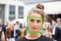 Young woman picked out by face detection or facial recognition software