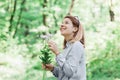 Young woman picking flowers in nature Royalty Free Stock Photo