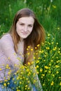 Young woman picking flowers on a summer meadow Royalty Free Stock Photo