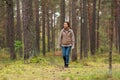young woman picking mushrooms in autumn forest Royalty Free Stock Photo