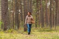 young woman picking mushrooms in autumn forest Royalty Free Stock Photo