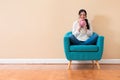 Young woman with a piggy bank Royalty Free Stock Photo