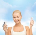 Young woman with pills Royalty Free Stock Photo
