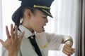 Woman pilot is upset at a flight delay Royalty Free Stock Photo