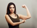 Young woman pinching arm fat skin