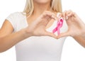 Young woman with pink cancer awareness ribbon