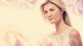 Young woman on a pink floral background Royalty Free Stock Photo