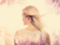 Young woman on a pink floral background Royalty Free Stock Photo