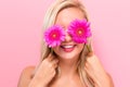 Young woman with pink garberas Royalty Free Stock Photo