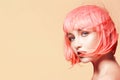 Young woman in pink wig. Beautiful model with fashion makeup. Bright spring look. hair color, medium hairstyle