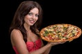 Young woman with pizza against black background Royalty Free Stock Photo