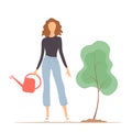 Young woman planting and watering a tree Royalty Free Stock Photo