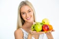 Young woman with plate of fresh fruit