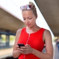 Young woman on platform of railway station. Royalty Free Stock Photo