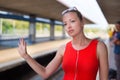 Young woman on platform of railway station. Royalty Free Stock Photo