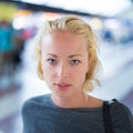 Young woman on platform of railway station. Royalty Free Stock Photo