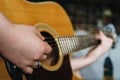 Young woman playing acoustic guitar at home Royalty Free Stock Photo