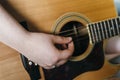Young woman playing acoustic guitar at home Royalty Free Stock Photo