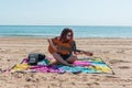 Young woman playing guitar on the beach Royalty Free Stock Photo