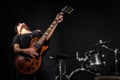 Young woman playing guitar during Royalty Free Stock Photo