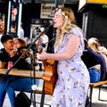 Young Woman Singer Entertaining Crowds In Camden Market London UK