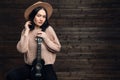 Young woman playing guitar and smiling. Music concept. Home atmosphere on background. Royalty Free Stock Photo