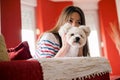 Young woman is playing with her dog Royalty Free Stock Photo