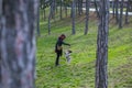 young woman playing with her dog in the park Royalty Free Stock Photo