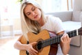 Young woman playing her guitar Royalty Free Stock Photo