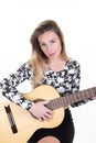 Young woman playing her guitar at home white wall background Royalty Free Stock Photo