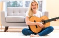 Young woman playing her guitar Royalty Free Stock Photo