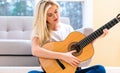 Young woman playing her guitar Royalty Free Stock Photo