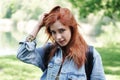 Young woman playing with her hair and giving a coy look