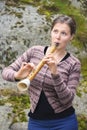 Young woman playing hornpipe
