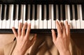 Young woman playing piano, above view. Music lesson Royalty Free Stock Photo