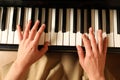 Young woman playing piano, above view. Music lesson