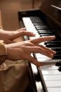 Young woman playing piano, closeup. Music lesson Royalty Free Stock Photo