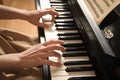 Young woman playing piano, closeup. Music lesson Royalty Free Stock Photo