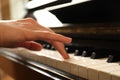 Young woman playing piano, closeup. Music lesson Royalty Free Stock Photo