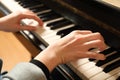 Young woman playing piano, closeup. Music lesson Royalty Free Stock Photo